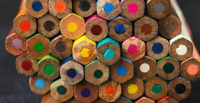 Stack of colorful pencils tips, art background